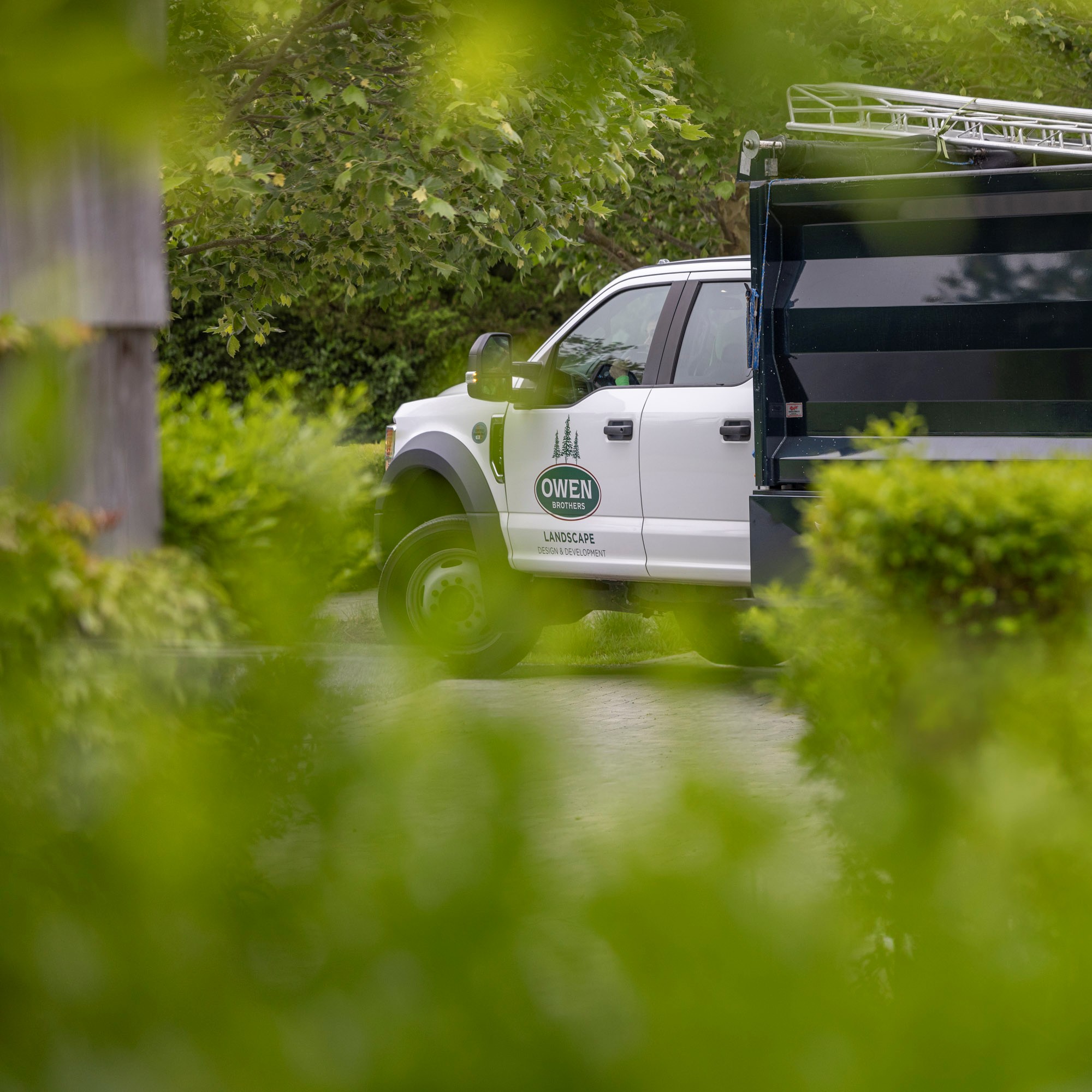 Owen Brothers Landscaping truck on site.