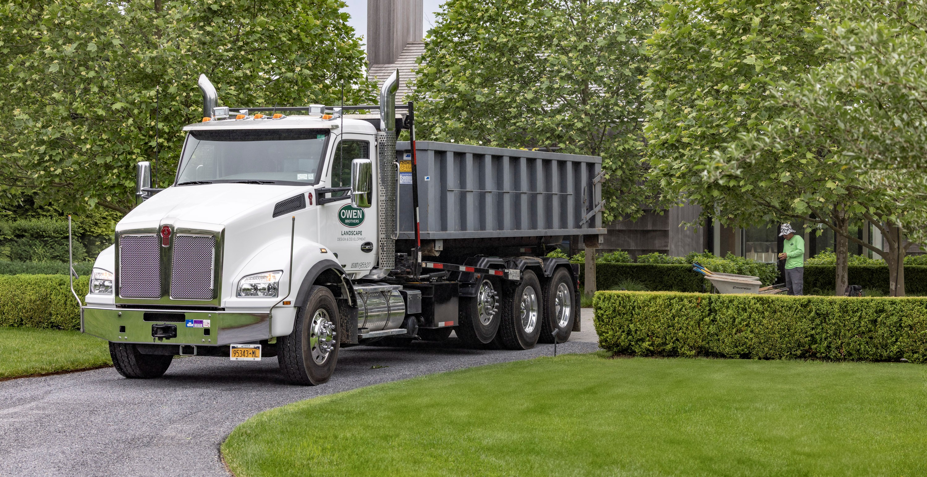 Owen Brothers Lanscaping truck on site for property care.